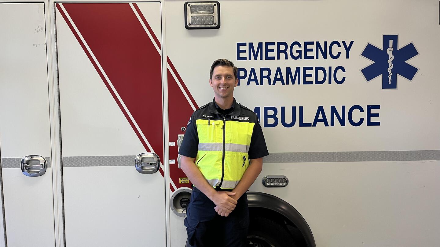 Dr. Jacob Hutton in front of ambulance