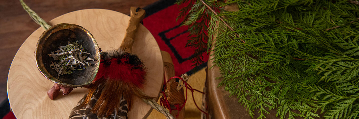 Incense, feathers and pine needles
