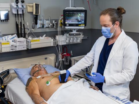 Dr. Oron Frenkel scans a patient