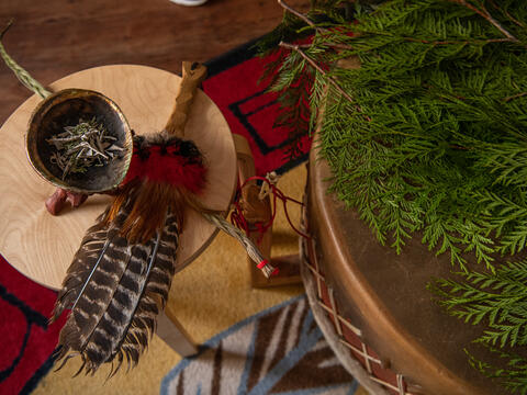 Incense, feathers and pine needles